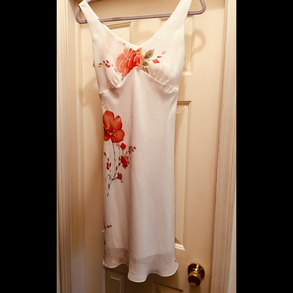 Alyn Paige dress with floral accents.